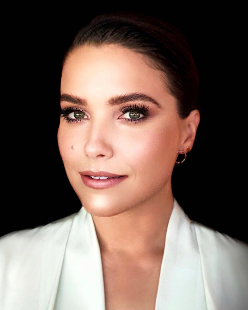Portrait of Sophia Bush in white blazer and Maya Brenner Open Eclipse Earring large and solid eclipse earring mini