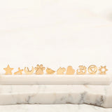 Several Charm Studs – Star, Cross, Moon, Paw, Angel Wing, Hamsa, Heart, Om, Recovery and Star of David laid on a marble stone surface and a white background. 