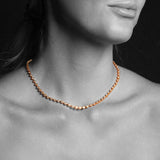Close-up of a woman's neck wearing The Ultimate Diamond Necklace. 