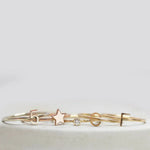 Five gold rings, including two Letter Rings (C and F), a Number 5 Ring, a Twinkle Twinkle Ring and a Birthstone Ring.