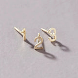 14K Gold Number Studs in 1, 2 and 3 against a light grey background. 