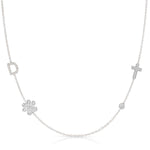 white gold Necklace with various pendants including a clover, cross, and diamond on a white background