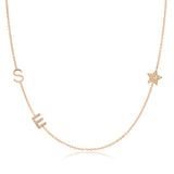 A Custom Gold Necklace in rose gold with two letter charms, a pavé E and an S positioned on the left side of the necklace, and a star charm positioned on the right side, on a white background.