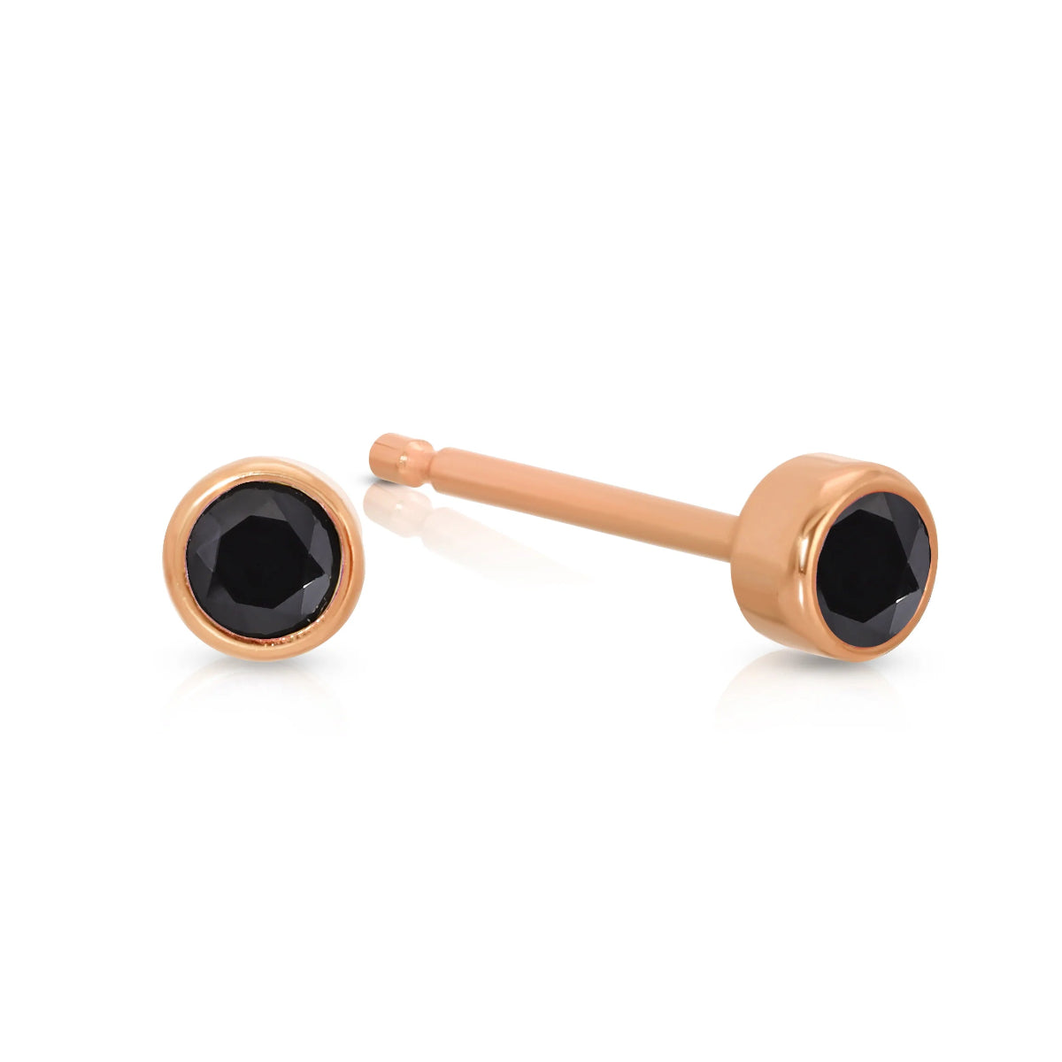 A pair of Birthstone Studs - Onyx (August) in rose gold on a white background.
