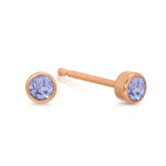 A pair of Birthstone Studs - Tanzanite (December) in rose gold on a white background.