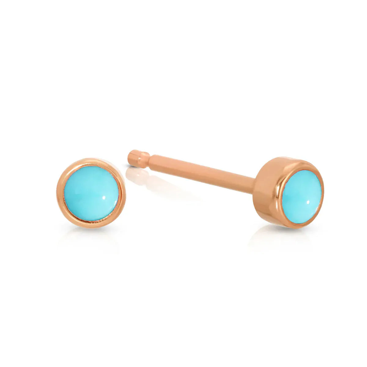 A pair of Birthstone Studs - Turquoise (December) in rose gold on a white background.