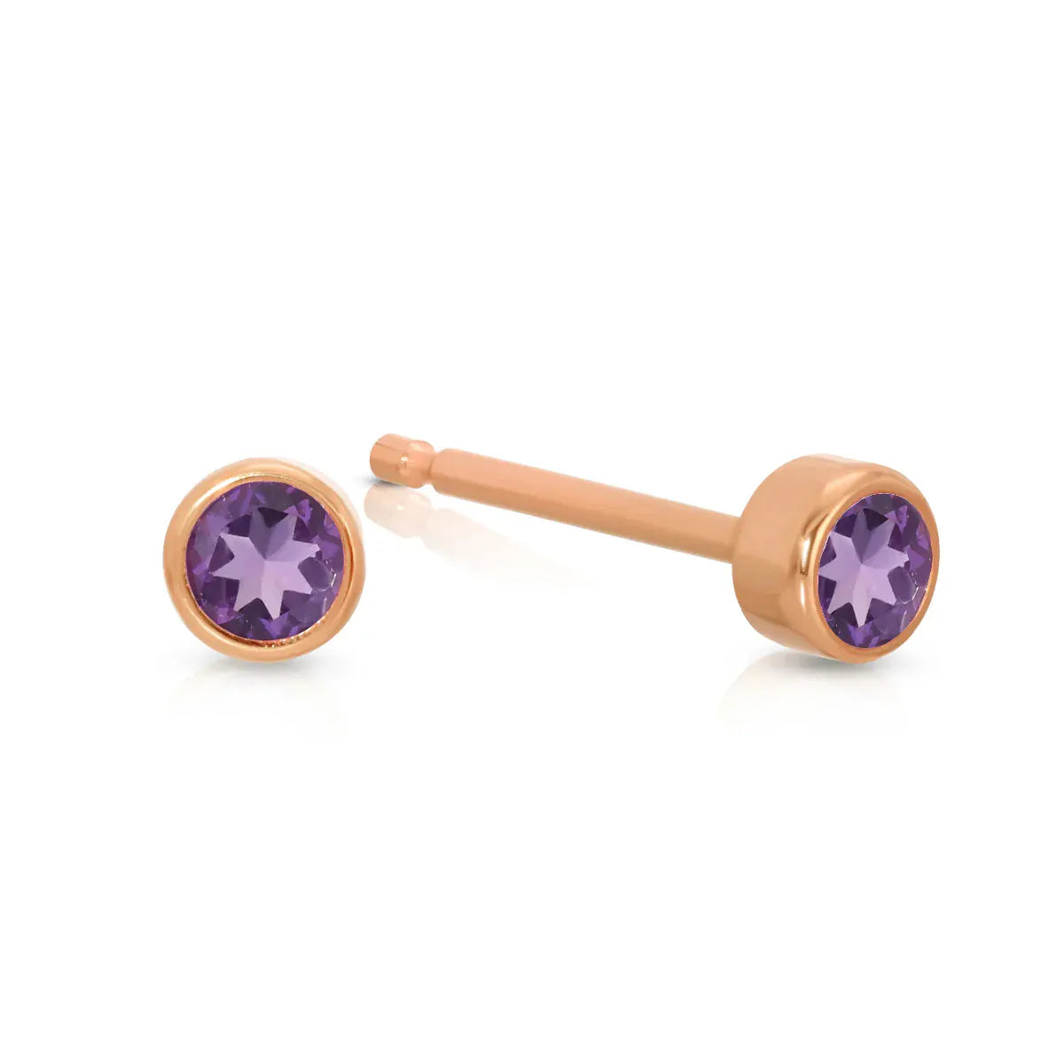A pair of Birthstone Studs - Amethyst (February) in rose gold on a white background.