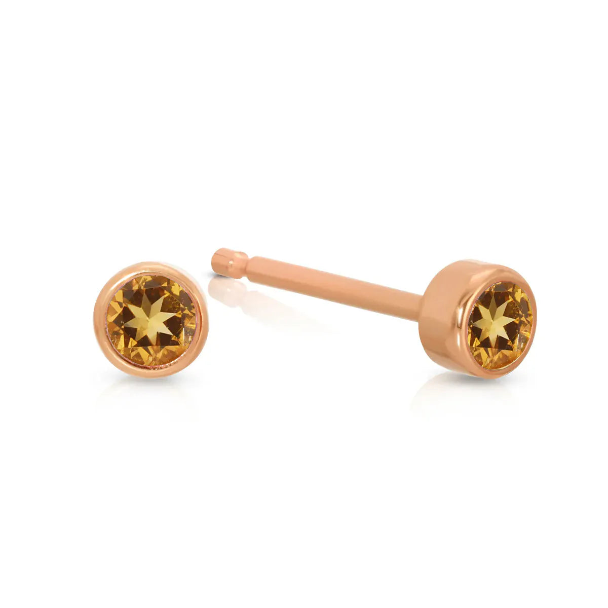 A pair of Birthstone Studs - Citrine (November) in rose gold on a white background.