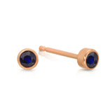 A pair of Birthstone Studs - Sapphire (September) in rose gold on a white background.
