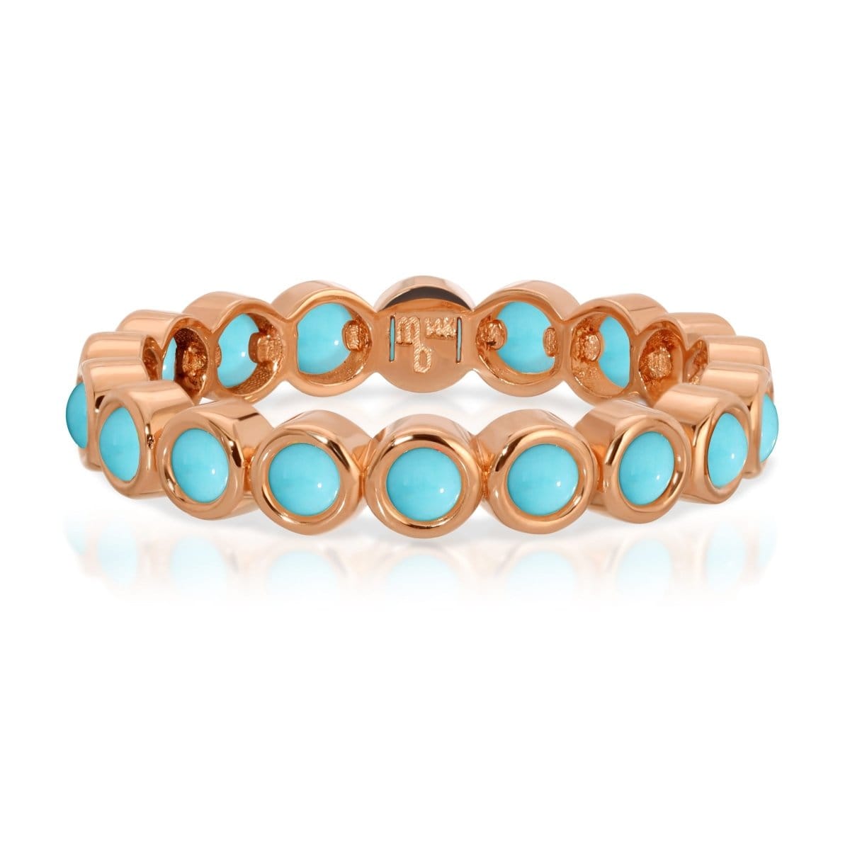 The Bluebell Bouquet Ring in rose gold on a white background. 