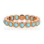 The Bluebell Bouquet Ring in rose gold on a white background. 