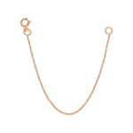 A rose gold Chain Extender on a white background. 
