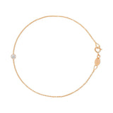 A rose gold Birthstone Bracelet with a cable chain and a diamond birthstone on a white background.