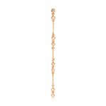 A Stardust Earring in rose gold on a white background. 
