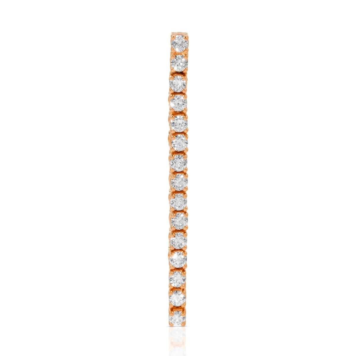 A Down the Line Earring in rose gold on a white background. 