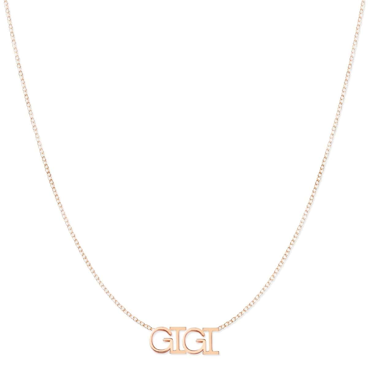 A GIGI Necklace in rose gold on a cable chain on a white background.