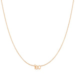 Petite Zodiac Necklace ‘leo’ in rose gold on a white background.