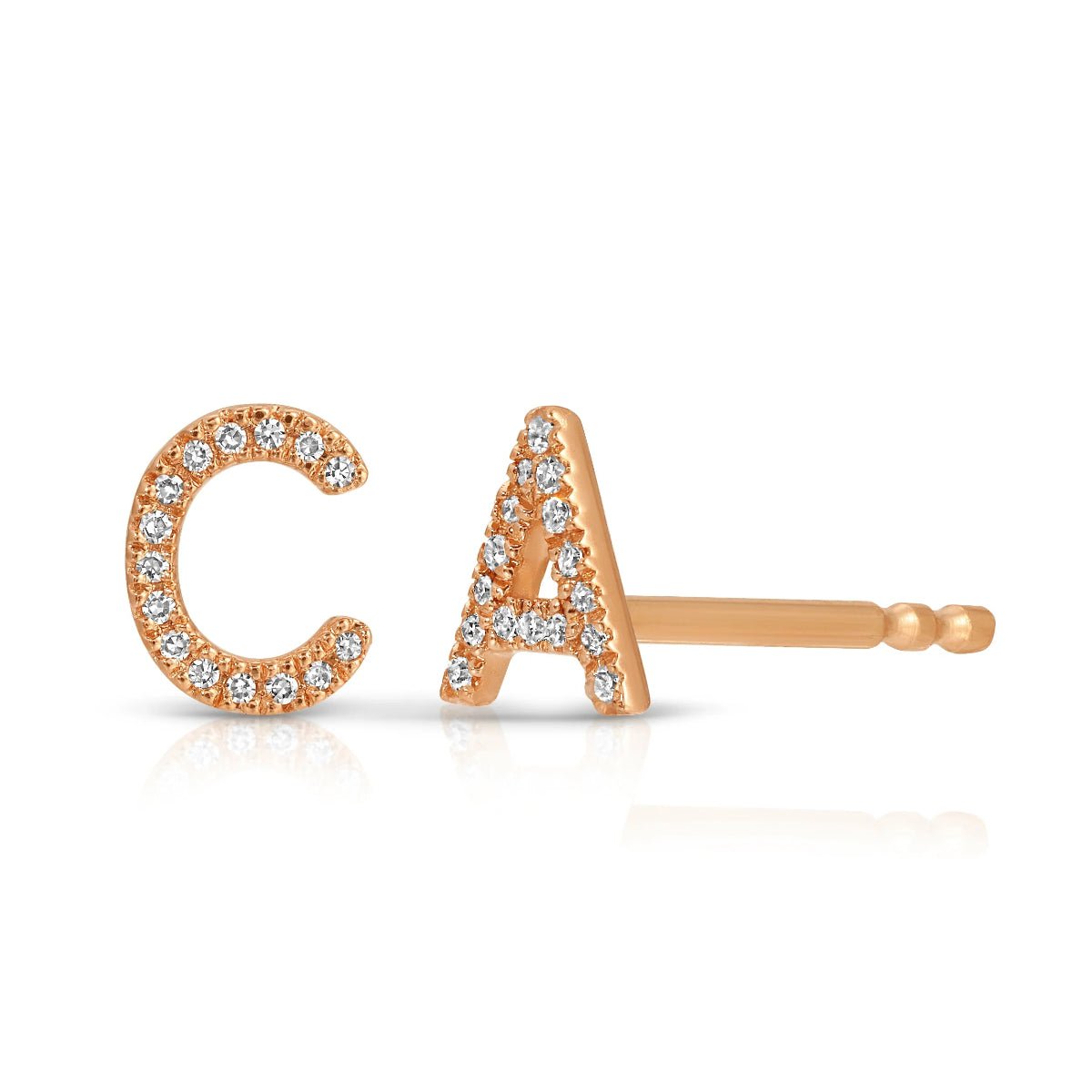 Rose gold pave earrings with C and A letters on a white background. 