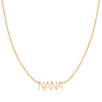 A NANA Necklace in rose gold on a bead chain on a white background.
