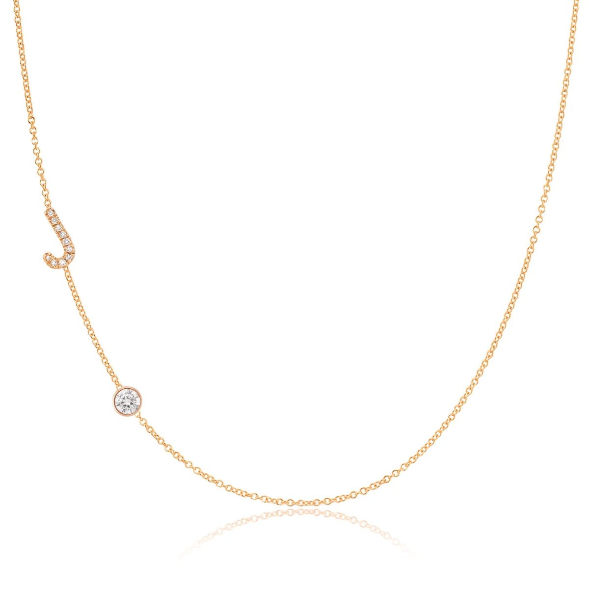 A Pavé Monogram Necklace with Diamond  and a letter J charm in rose gold on a white background.