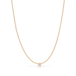 A Single Diamond Layering Necklace in rose gold on a white background. 