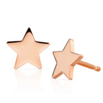 A pair of  14K Gold Charm Stud - Star in rose gold on a white background.