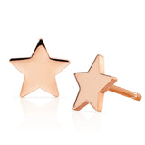 A pair of  14K Gold Charm Stud - Star in rose gold on a white background.