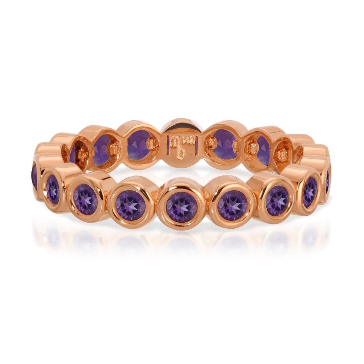 The Violet Bouquet Ring in rose gold on a white background. 