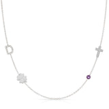 Necklace with various pendants including a clover, cross, and purple gemstone on a white background