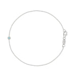 A white gold Birthstone Bracelet with a beaded chain and an aquamarine birthstone on a white background.