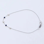 A white gold Custom Gold Bracelet – 5 Letters with five birthstones (three diamond and two sapphire) on a white background.