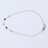 A white gold Custom Gold Bracelet – 5 Letters with five birthstones (three diamond and two sapphire) on a white background.