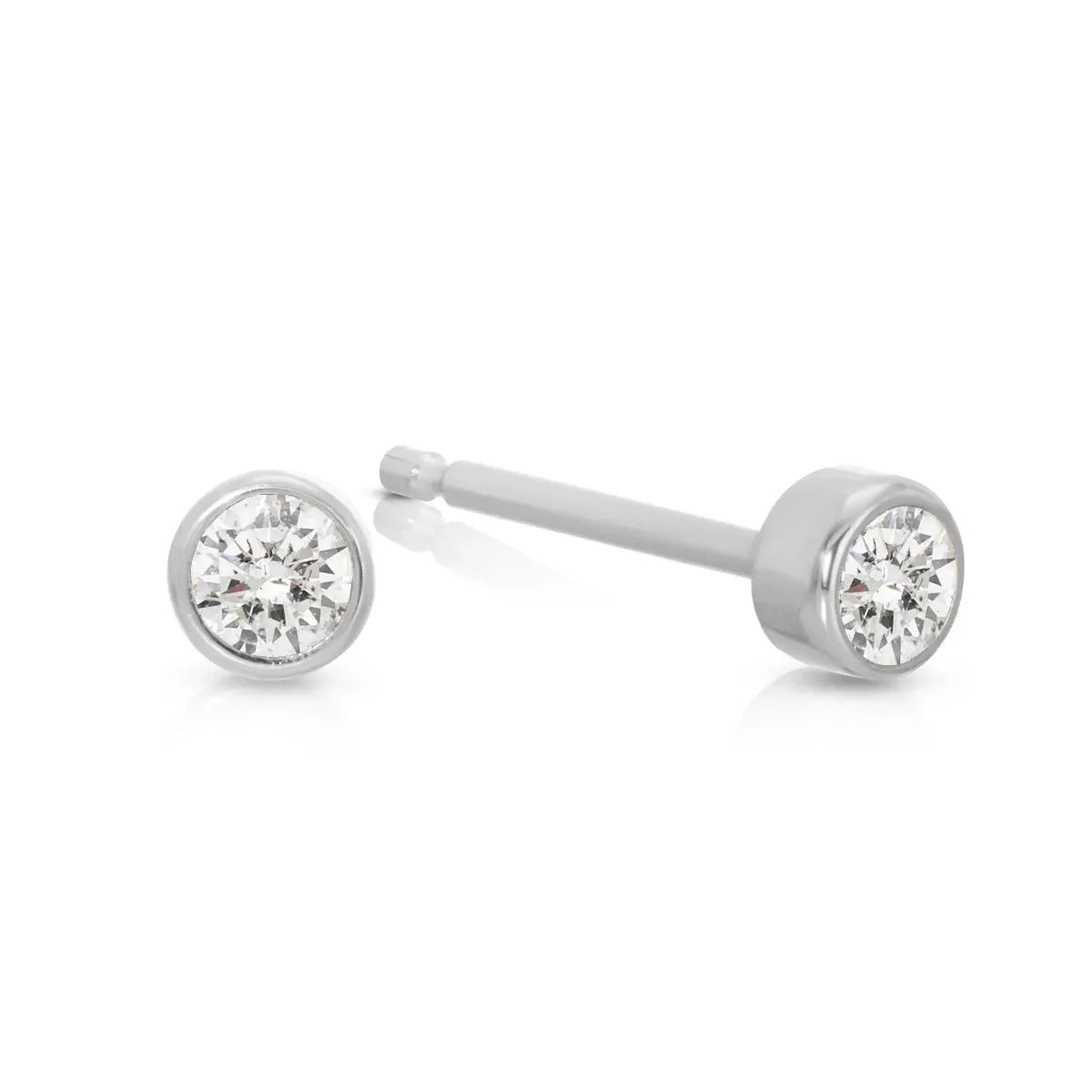 A pair of Birthstone Studs - Diamond (April) in white gold on a white background.
