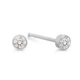 A pair of Birthstone Studs - Diamond (April) in white gold on a white background.