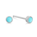 A pair of Birthstone Studs - Turquoise (December) in white gold on a white background.