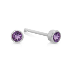 A pair of Birthstone Studs - Amethyst (February) in white gold on a white background.