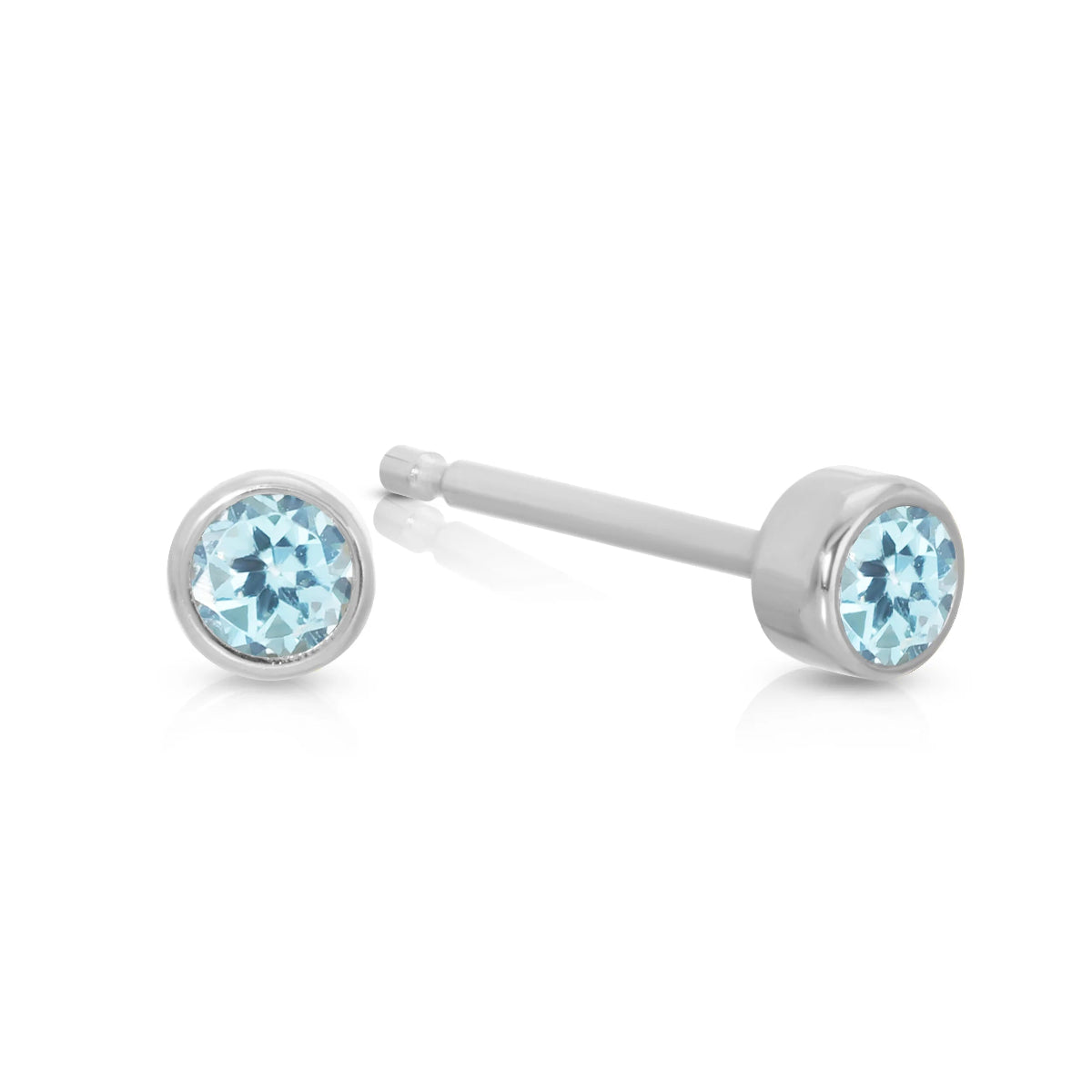 A pair of Birthstone Studs - Aquamarine (March) in white gold on a white background.