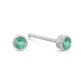 A pair of Birthstone Studs - Emerald (May) in white gold on a white background.
