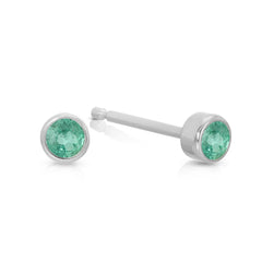 A pair of Birthstone Studs - Emerald (May) in white gold on a white background.