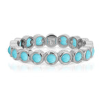 The Bluebell Bouquet Ring in white gold on a white background. 