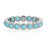 The Bluebell Bouquet Ring in white gold on a white background. 