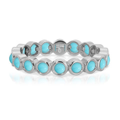 The Bluebell Bouquet Ring in white gold on a white background. 