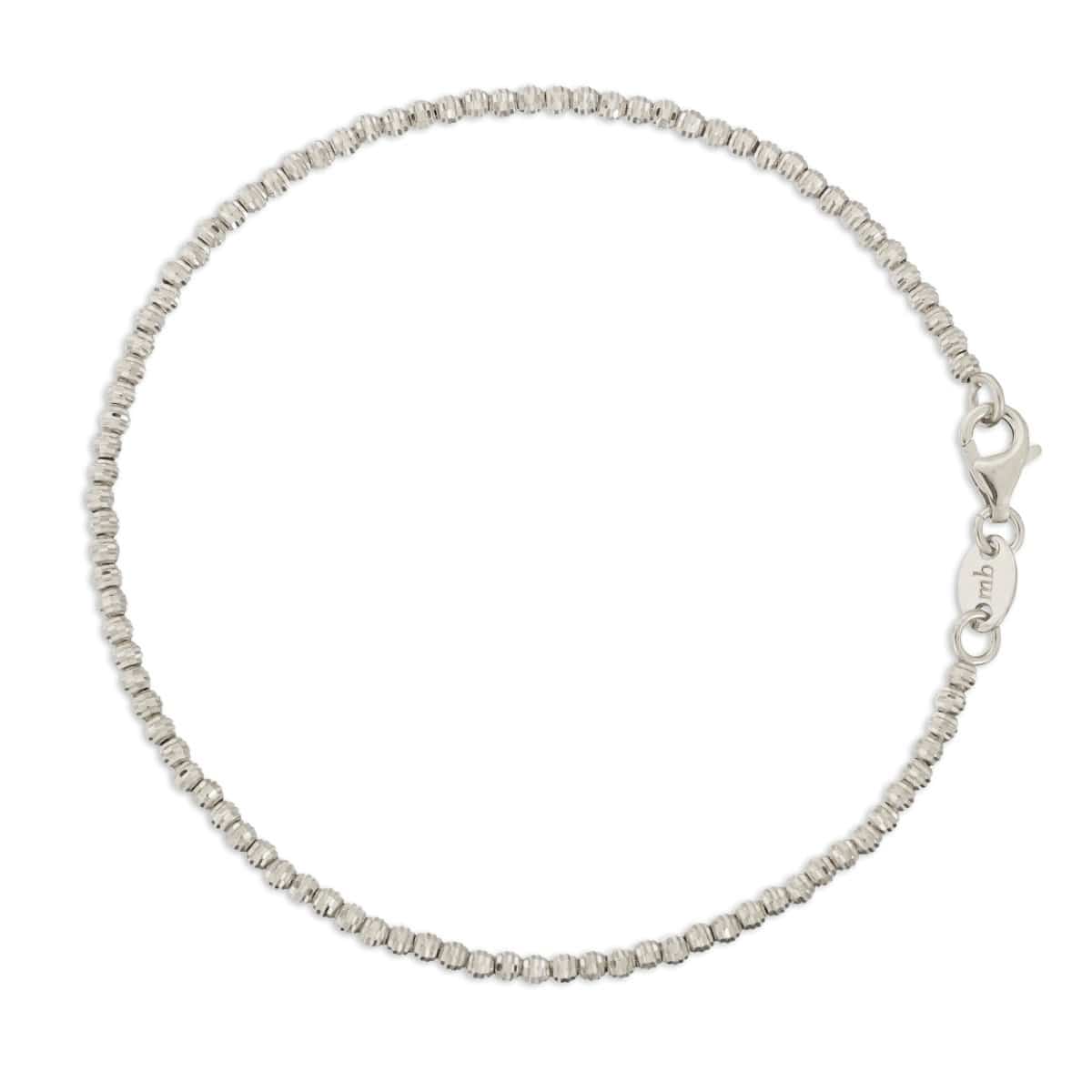 A Diamond Cut Bracelet in white gold on a white background. 