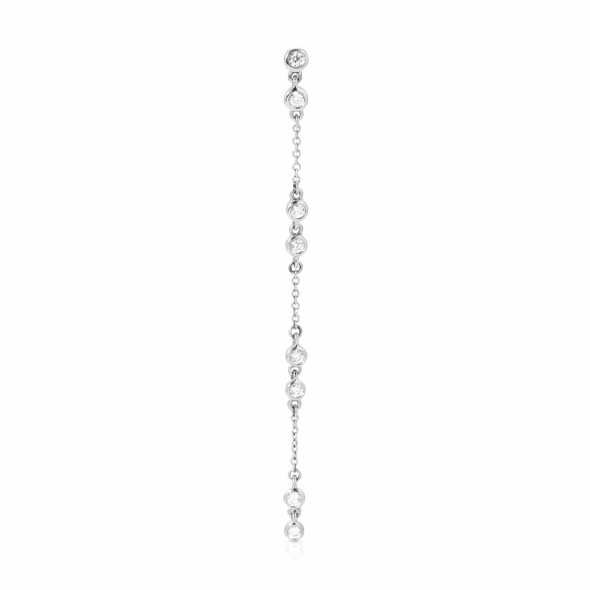 A Stardust Earring in white gold on a white background. 