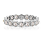 The Lily Bouquet Ring in white gold on a white background.