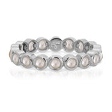 The Lily Bouquet Ring in white gold on a white background.