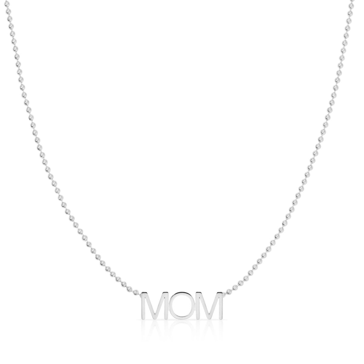 A MOM Necklace in white gold on a bead chain on a white background. 

