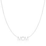 A MOM Necklace in white gold on a cable chain on a white background. 