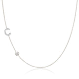 A Pavé Monogram Necklace with Diamond  and a letter C charm in white gold on a white background.