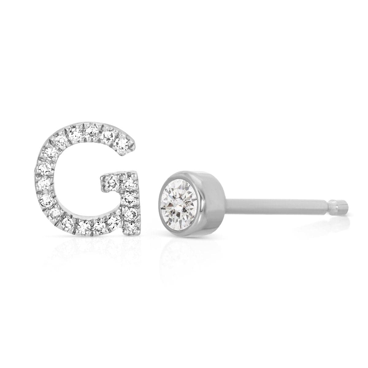 A Pavé Monogram Earring Set in the letter G in white gold on a white background.